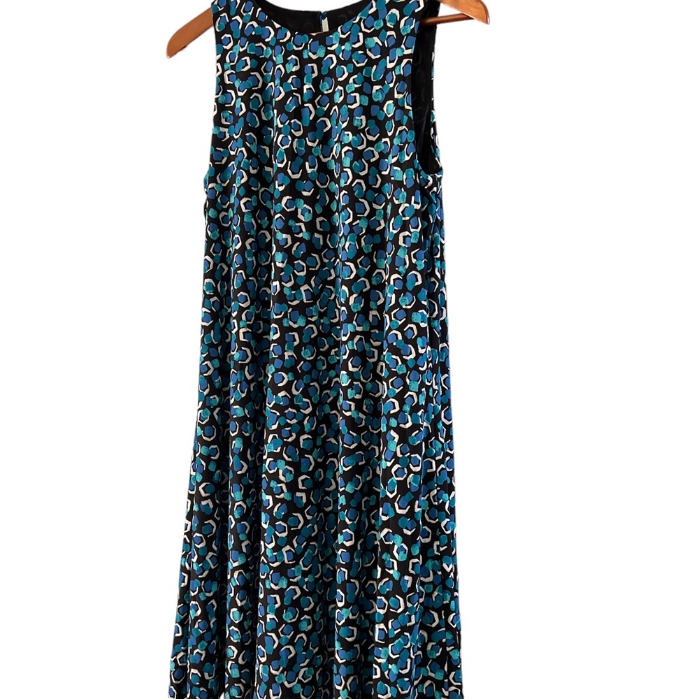 Women’s dress by Pappagallo. A teal,white,& gold pattern on a black background.